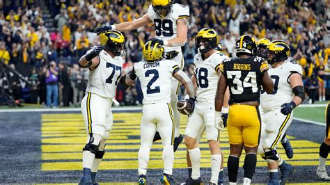 No. 2 Michigan beats No. 18 Iowa 26-0 for Big Ten title, likely to claim top playoff seed